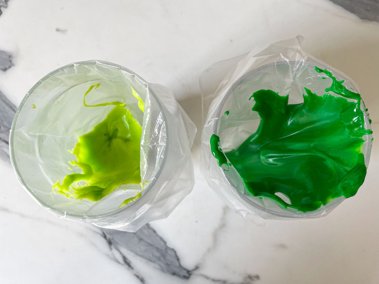 Two piping bags of green icing