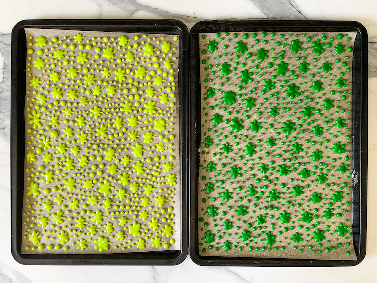 Two small trays with piped shamrock sprinkles