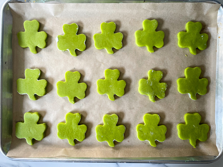 Shamrock cookies arranged on a tray