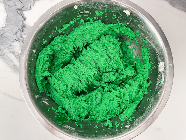 Green buttercream in a bowl