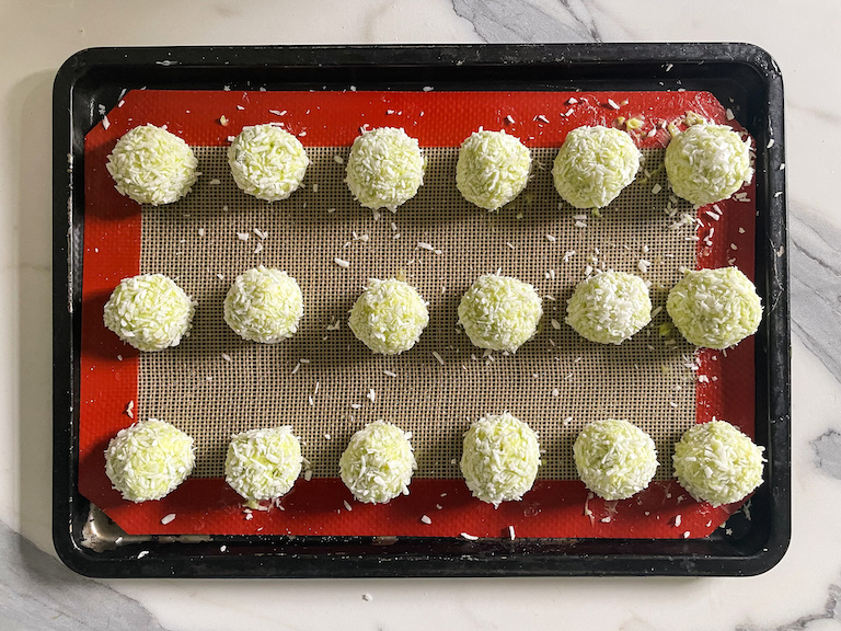 Green truffles arranged on a tray