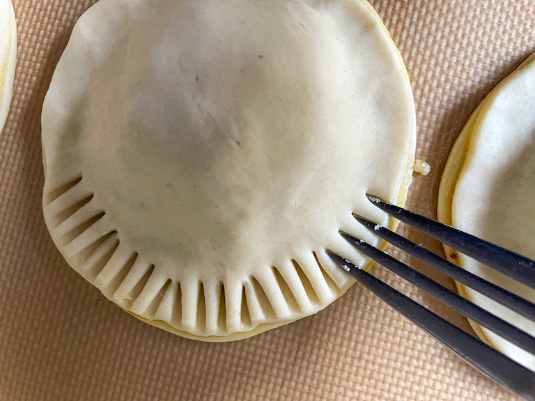 Fork crimping the edges of a hand pie