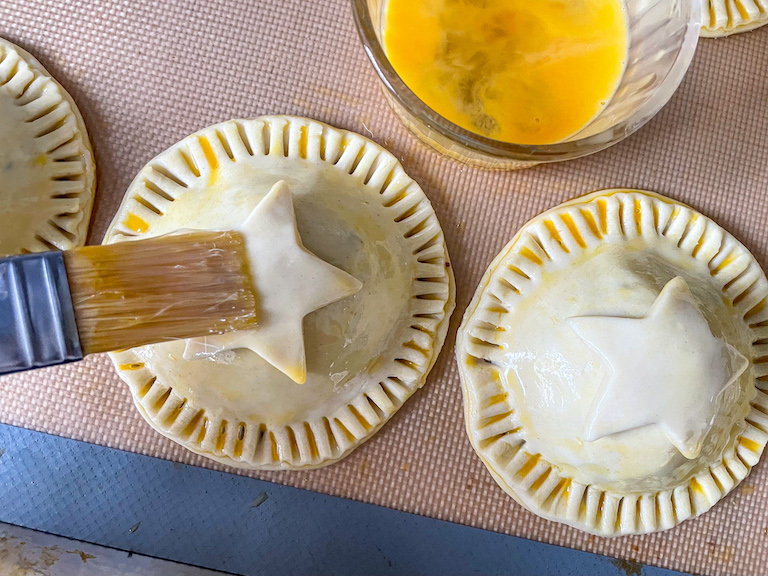 Egg washing unbaked hand pies