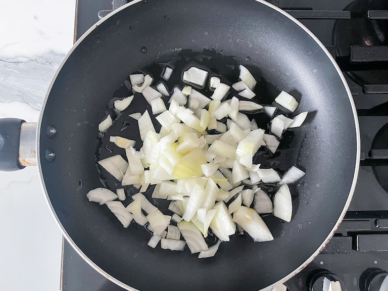 Onions in a pan on the stovetop