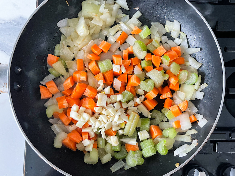 Pot pie vegetables in a pan