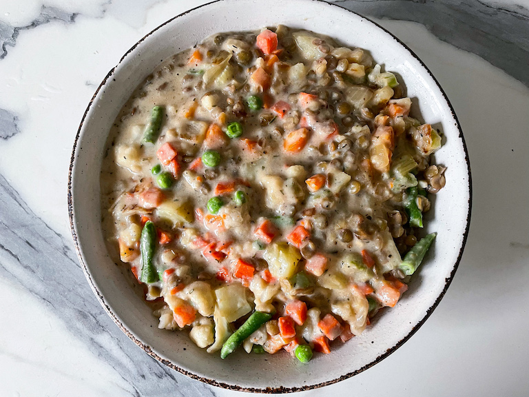 Vegetarian pot pie filling in a baking dish