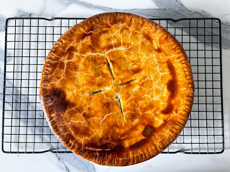 Meatless pot pie cooling on a wire rack