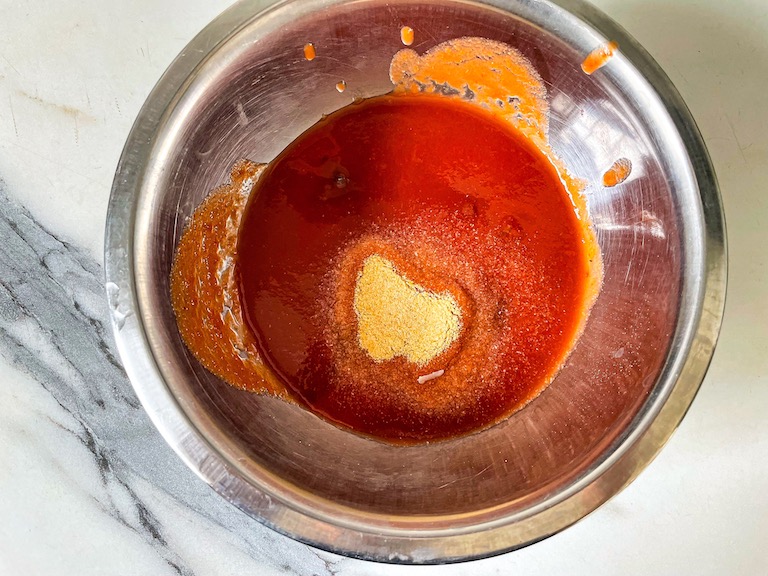 Tomato passata and spices in a bowl