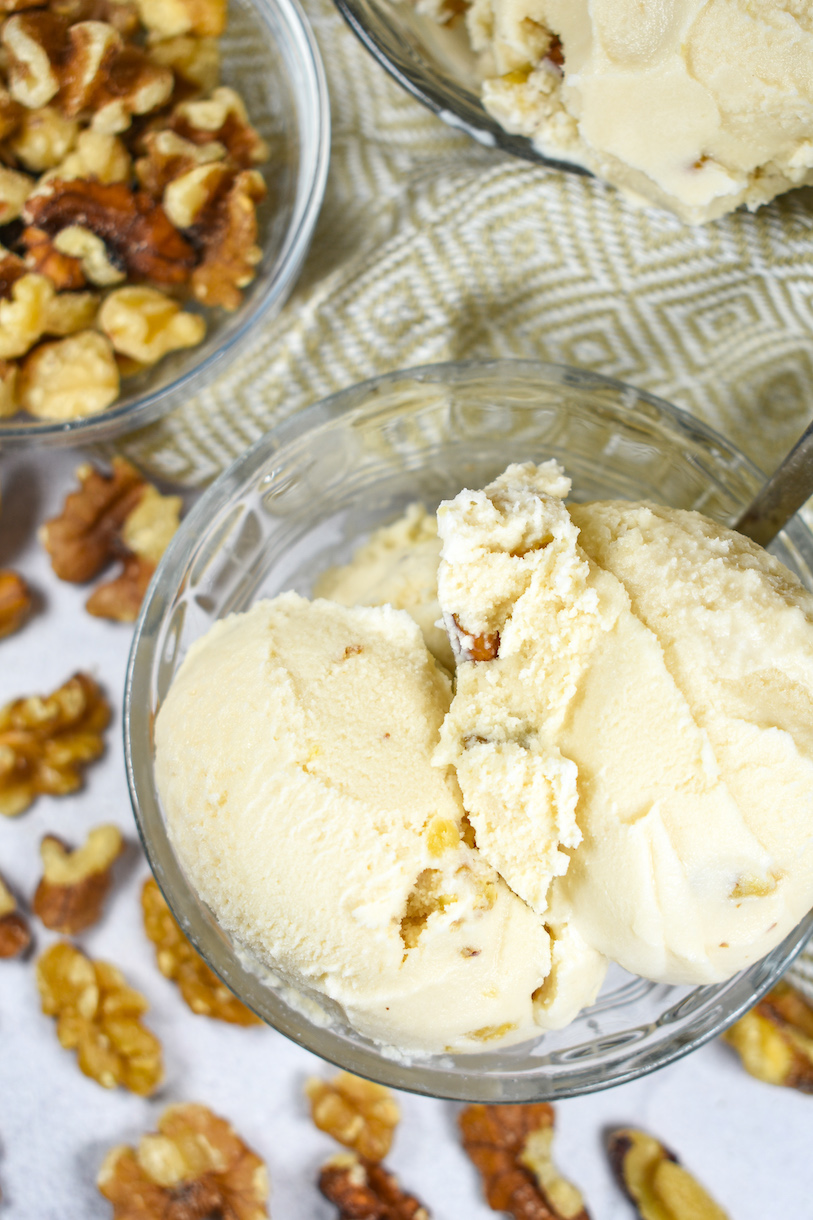 Dish of maple ice cream and dish of walnuts