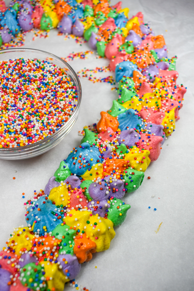 Meringue wreath and a bowl of rainbow sprinkles