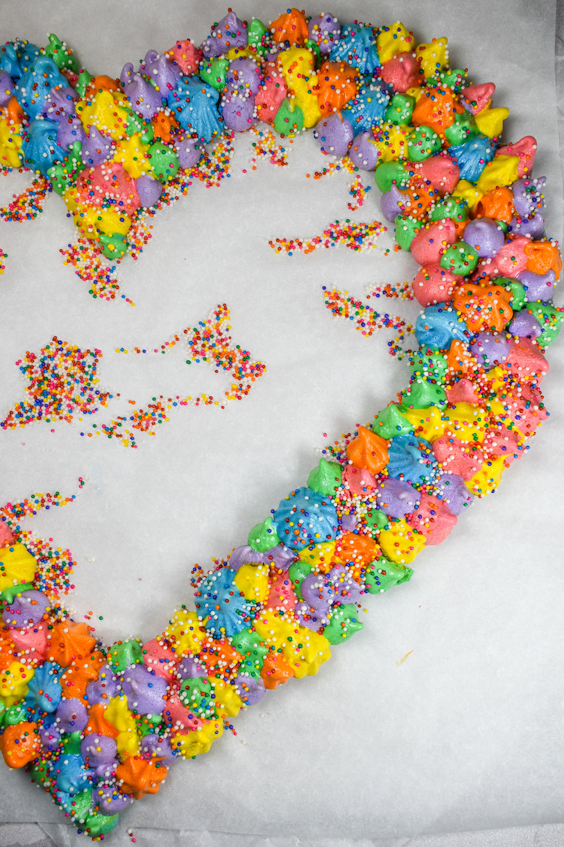 Rainbow meringue wreath in a heart shape