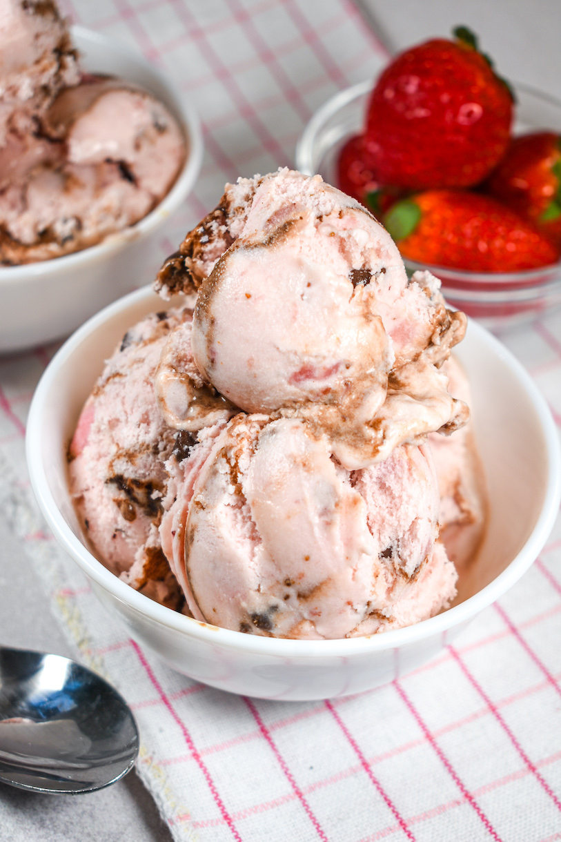 A dish of chocolate strawberry ice cream