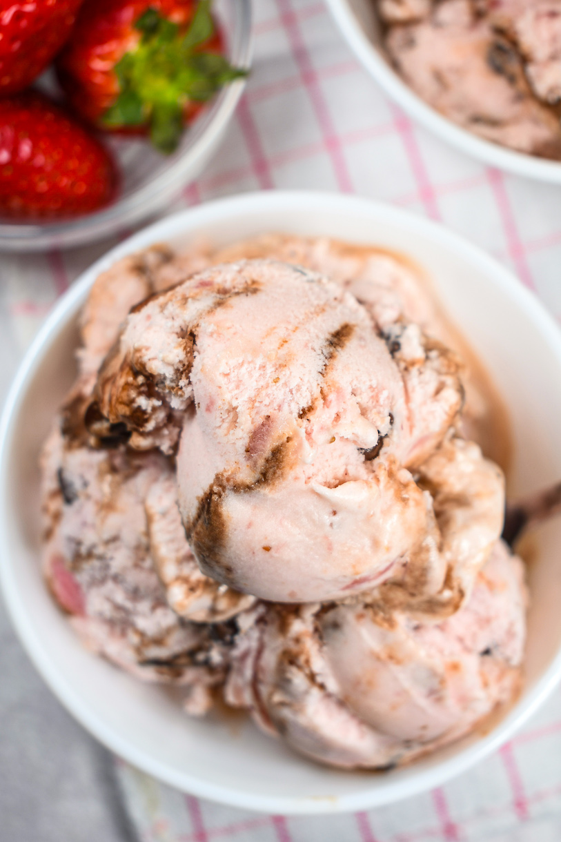 A dish of strawberry fudge ice cream