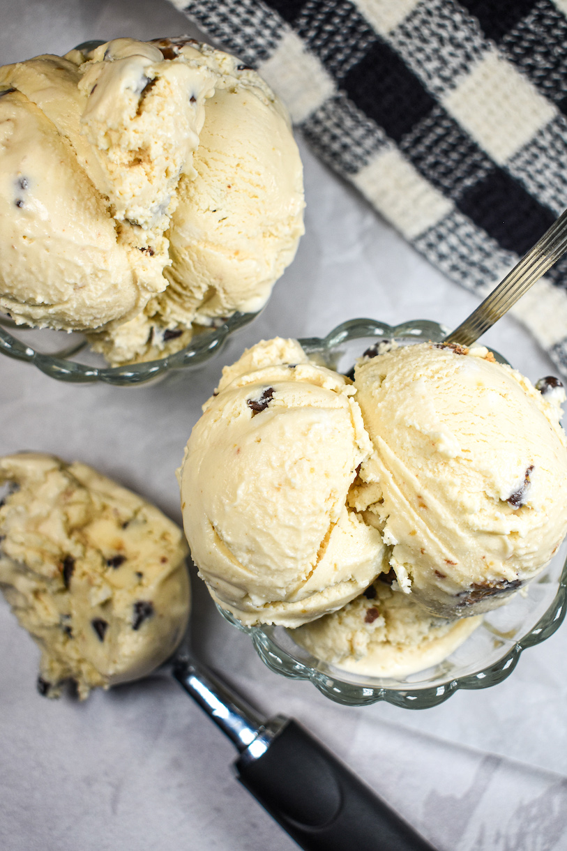 Dishes of peanut butter ice cream and a checkered tea towel