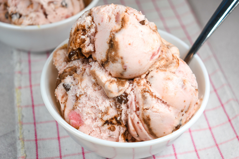 Dish of strawberry fudge ice cream