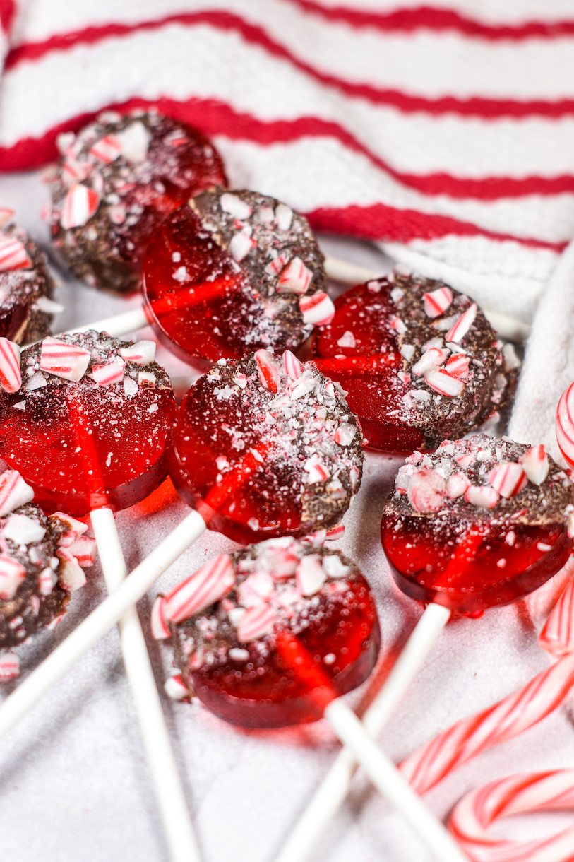 Chocolate dipped lollipops coated in peppermint candy