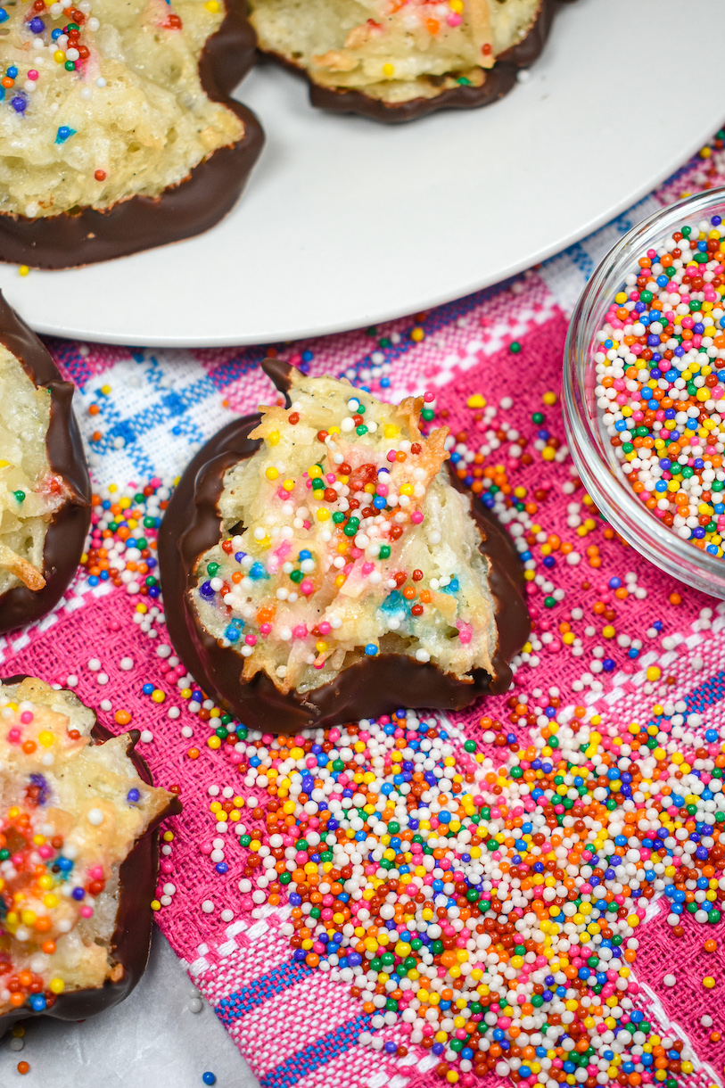 Birthday cake flavored macaroon surrounded by nonpareil sprinkles