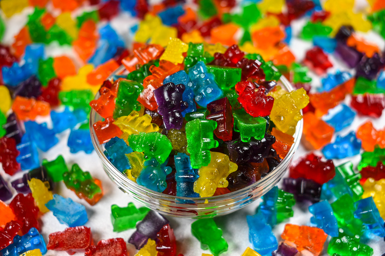 A dish of DIY gummy bears on a white surface