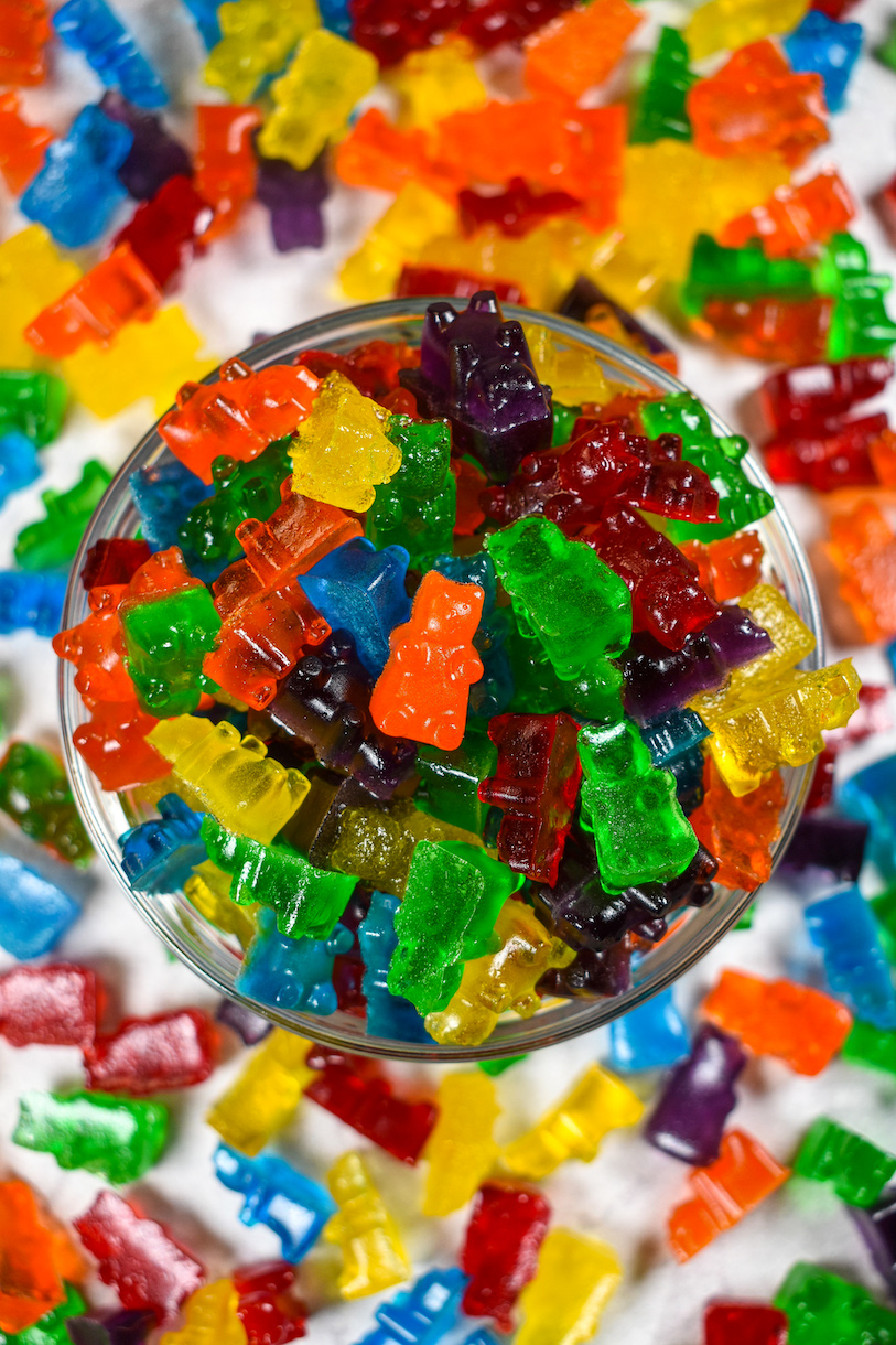 Looking down at a dish of rainbow gummy bears made with Jello