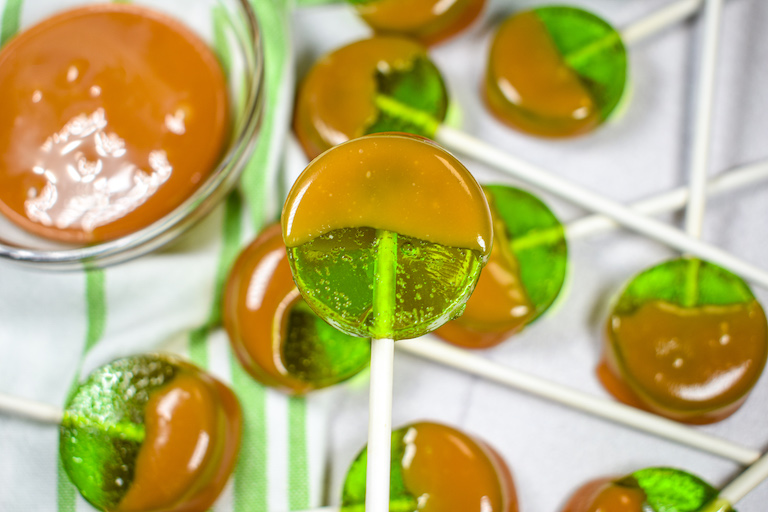 A caramel dipped apple lollipop