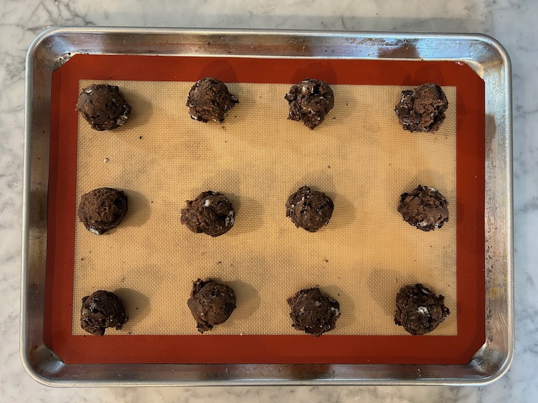 Scoops of Oreo cookie dough on a tray