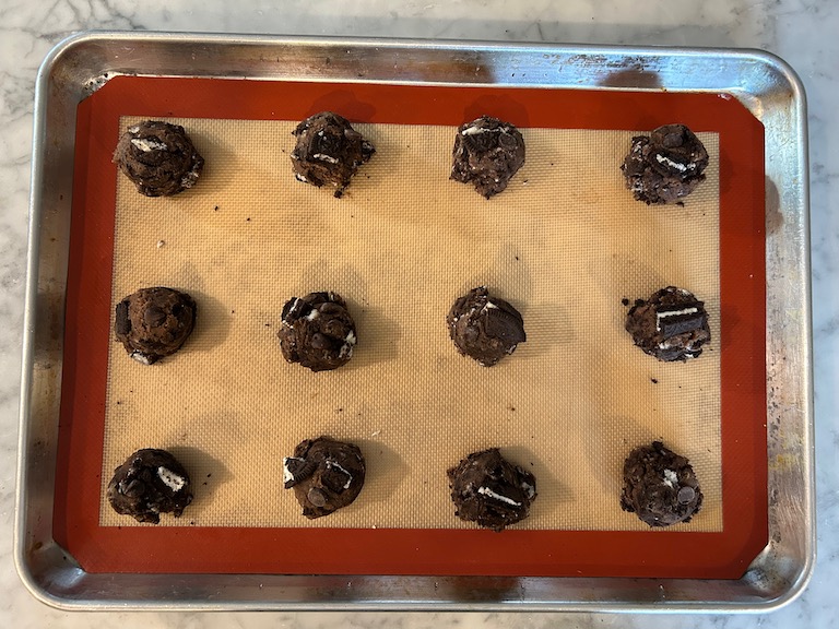 Scoops of cookie dough on a tray