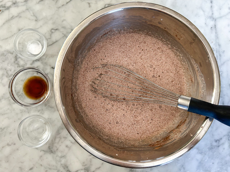 Smores ice cream base in a bowl with a whisk