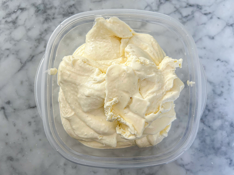 Ice cream scooped into a plastic container