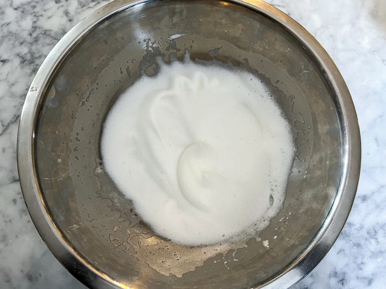 whipped egg whites in bowl