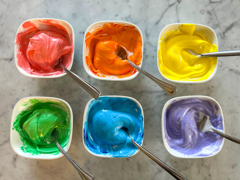 Bowls of rainbow meringue