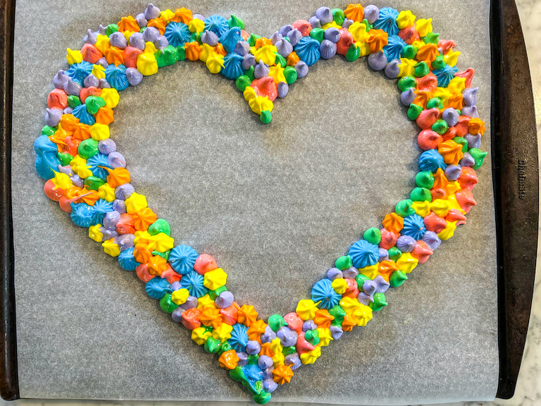 Heart shaped meringue wreath before baking