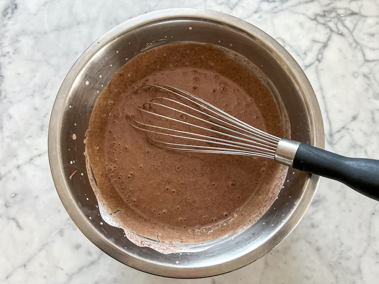 Whisking the base for chocolate hazelnut ice cream