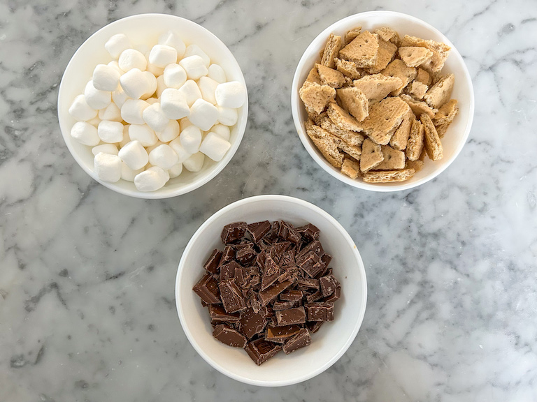 Marshmallow, graham cracker, and chocolate mix-ins for homemade smores ice cream