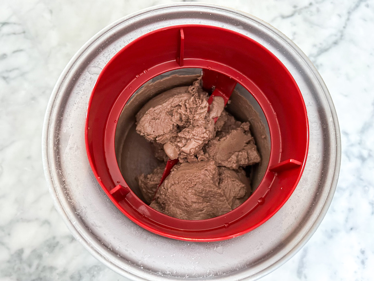 Chocolate hazelnut ice cream churning in an ice cream maker