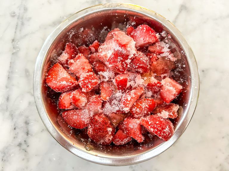 Strawberries tossed with granulated sugar, honey, and lemon