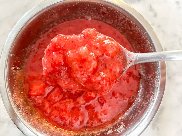 Spoonful of chunky strawberry puree