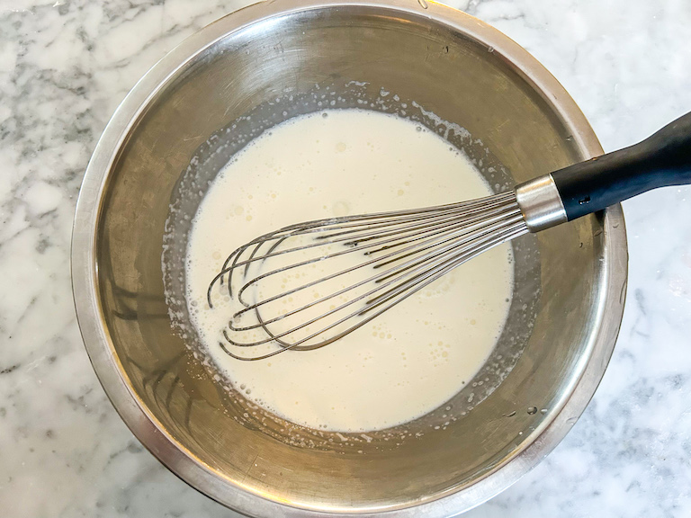 Whisk in a bowl of milk