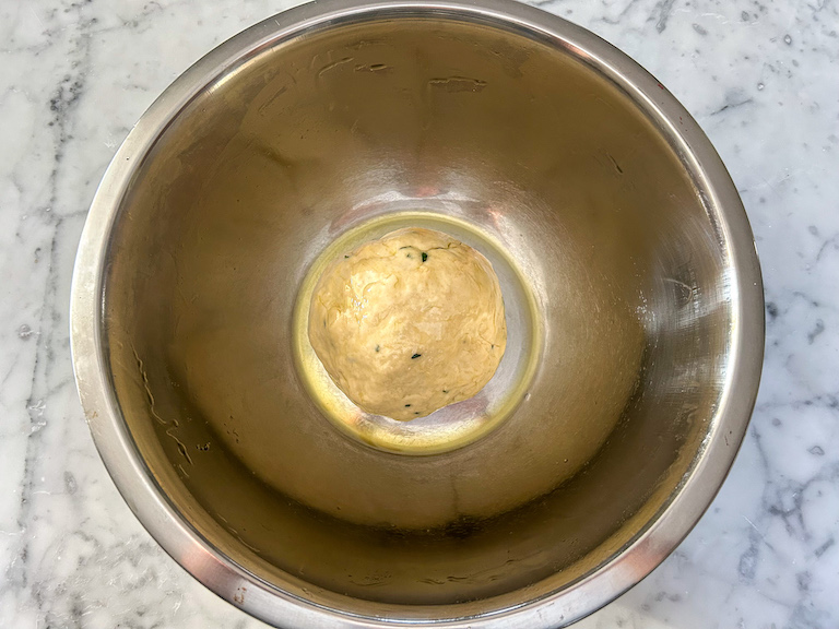 Apple focaccia dough in a bowl