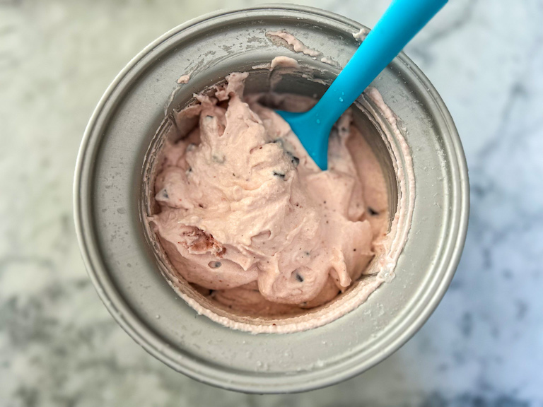 Ice cream maker filled with strawberry ice cream