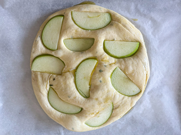 Apple slices pressed onto bread dough