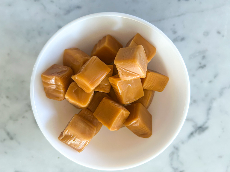 bowl of unwrapped kraft caramels