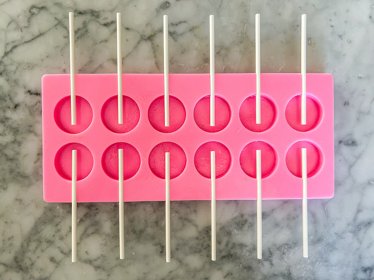 A pink silicone lollipop mould