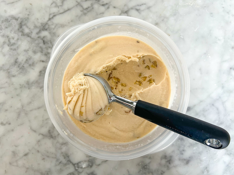 scooping maple walnut ice cream with an ice cream scoop