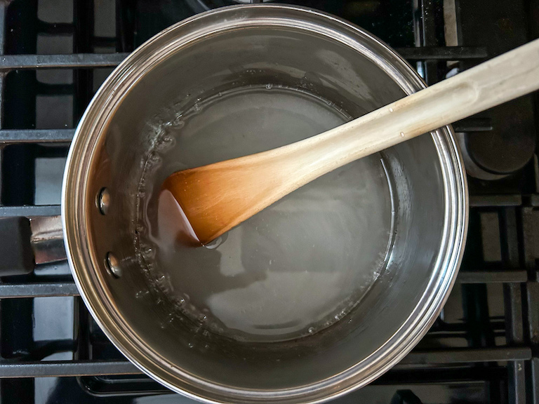 Sugar and water in a small pan on the stovetop