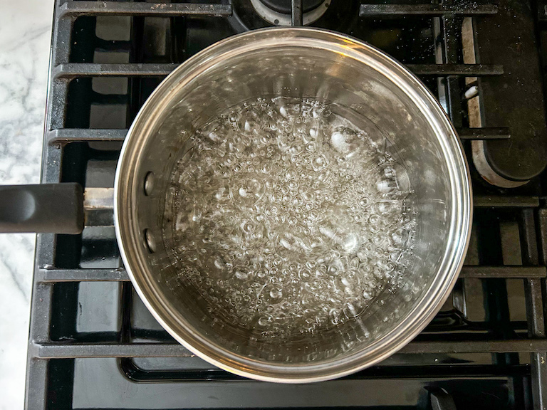 Sugar syrup cooking in a saucepan