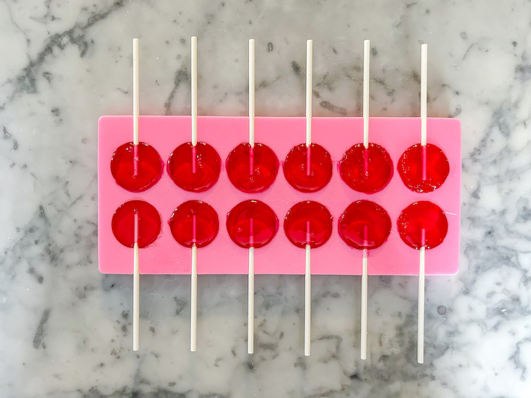 Pink mold with watermelon lollipops