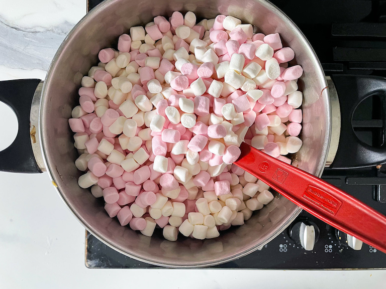 Pink and white mini marshmallows in a stock pot