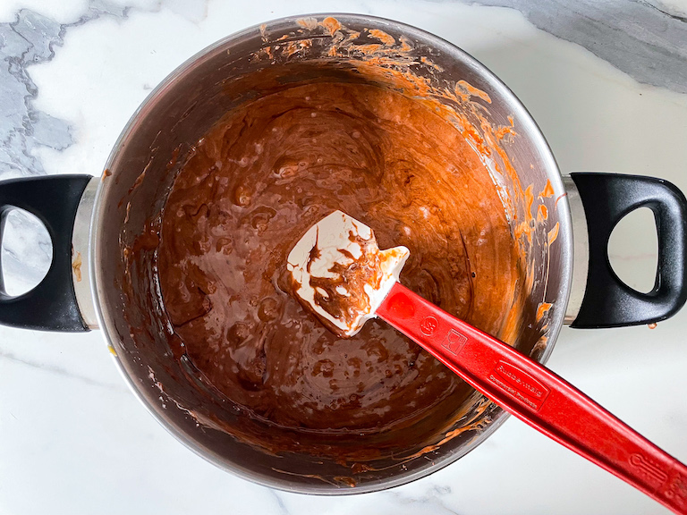 Nutella, butter, and melted marshmallows in a pan