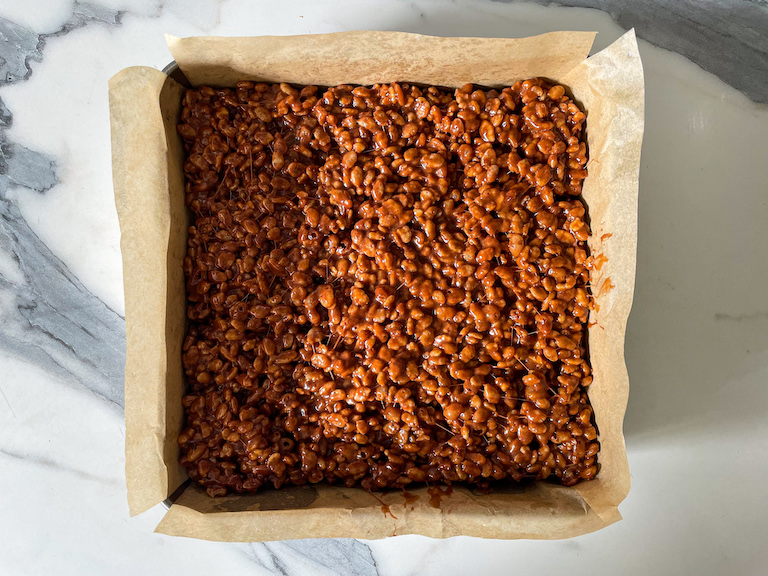 Nutella rice krispie treats pressed into square tin