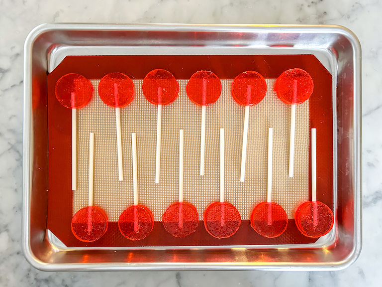 Pink lollipops arranged on a tray